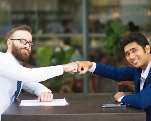 cheerful-business-partners-making-fist-bump_1262-16880 cheerful-business-partners-making-fist-bump_1262-16880